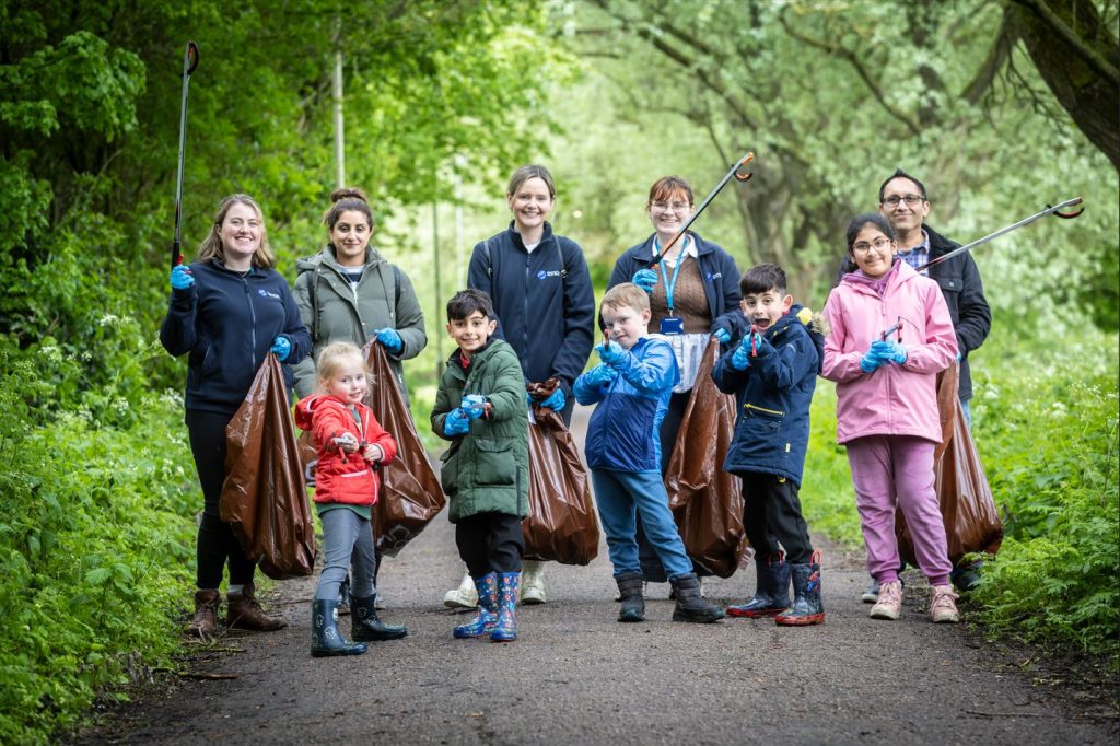 Students and NCEO staff litter picking near Space Park Leicester